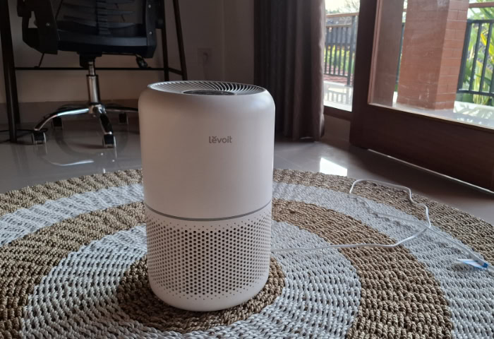 White Levoit Core 300 air purifier on woven rug