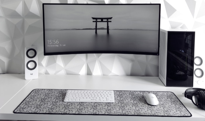 White pc gaming setup on white desk
