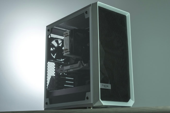 White PC case with visible internal components and cooling fans