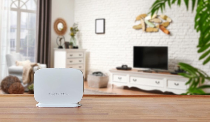 White modem on wooden desk