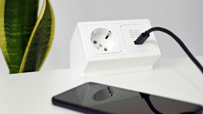 White power outlet with USB port and smartphone charging