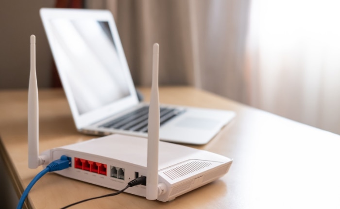 Wireless router and a laptop on a worktable