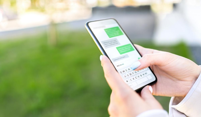 Woman chatting on smartphone