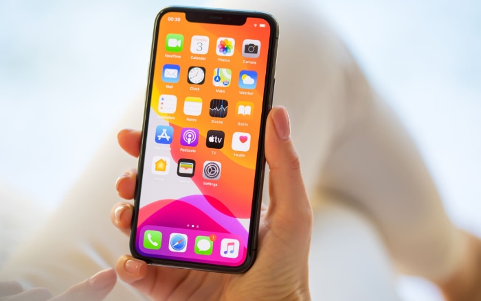 Woman holding black iphone