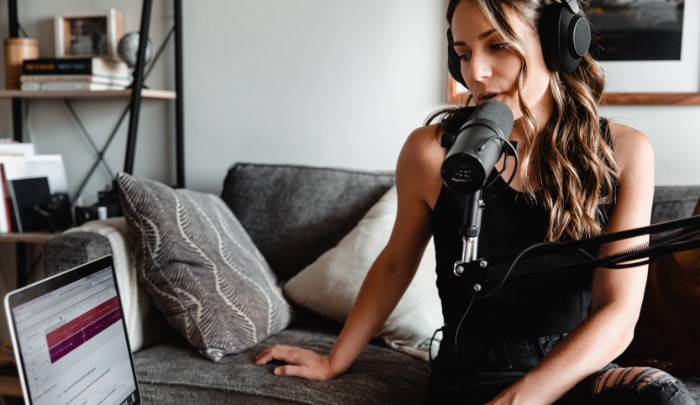 Woman podcasting from a cozy living room