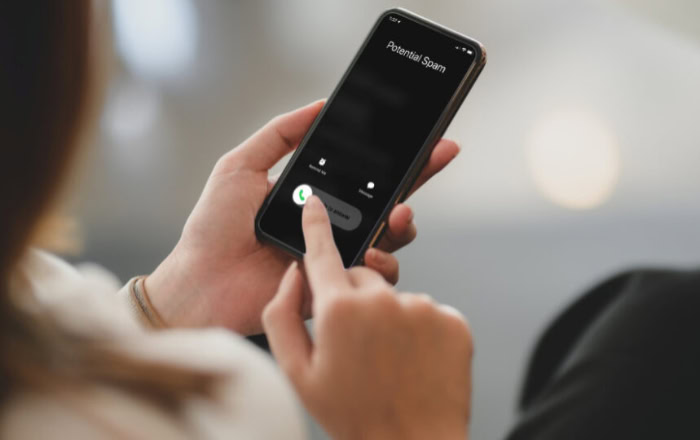 Woman receiving potential spam call on mobile