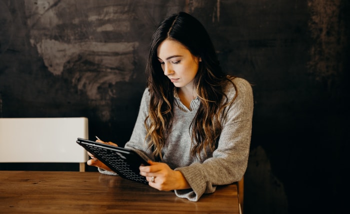 Woman using black tablet