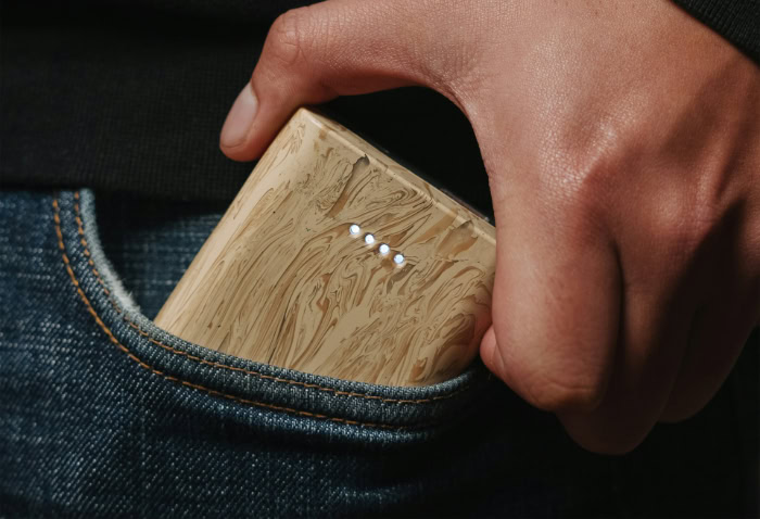 Wooden power bank fitting in jeans pocket