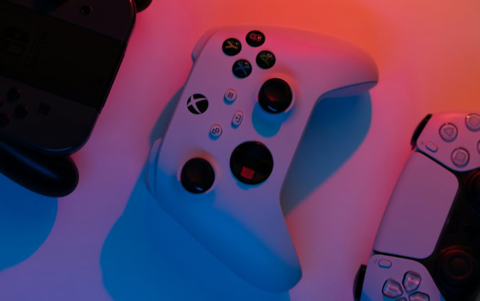 Xbox and PlayStation controllers close up