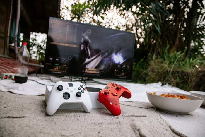Xbox controllers with snacks outdoors