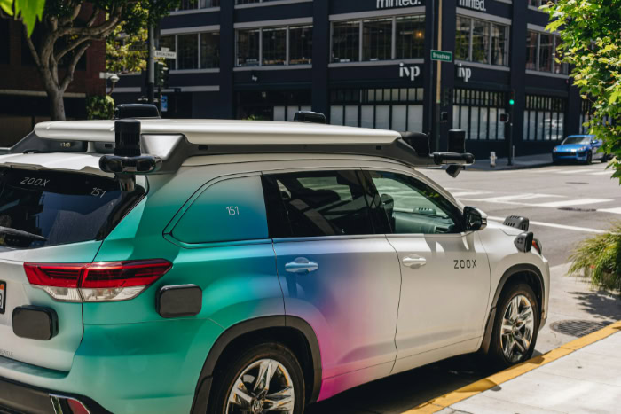 Zoox autonomous vehicle with sensors on city street