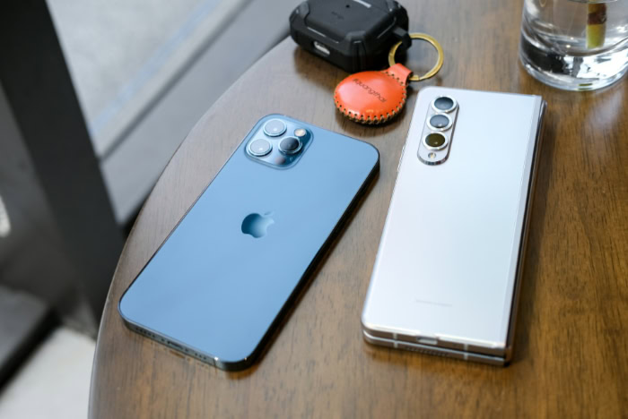 iPhone 12 Pro and Galaxy Z Fold3 on table