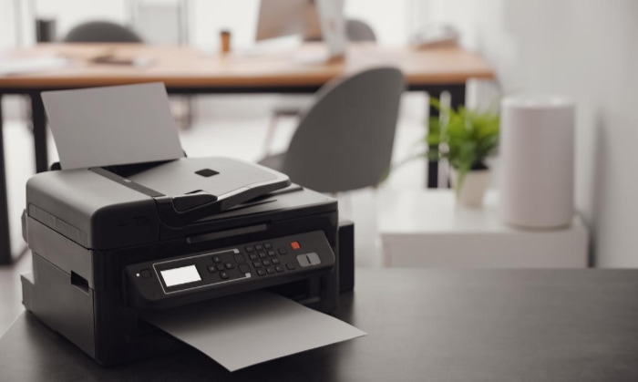 modern printer on table in office